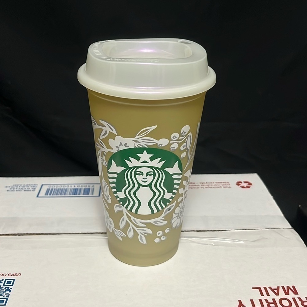Starbucks- tan and white plastic holiday cup
